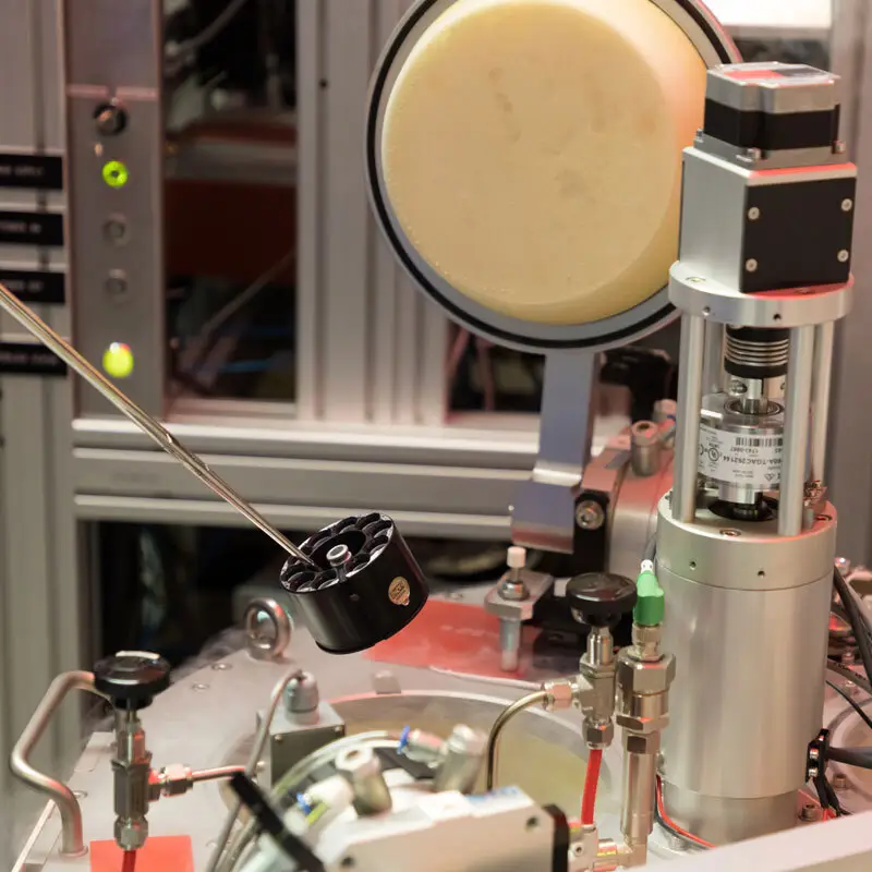 Sample holder (Puck) being inserted in the probe storage container