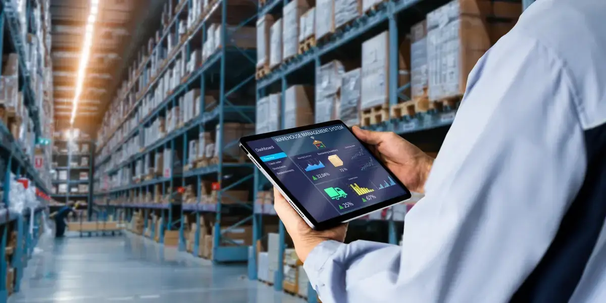Person holding tablet in warehouse